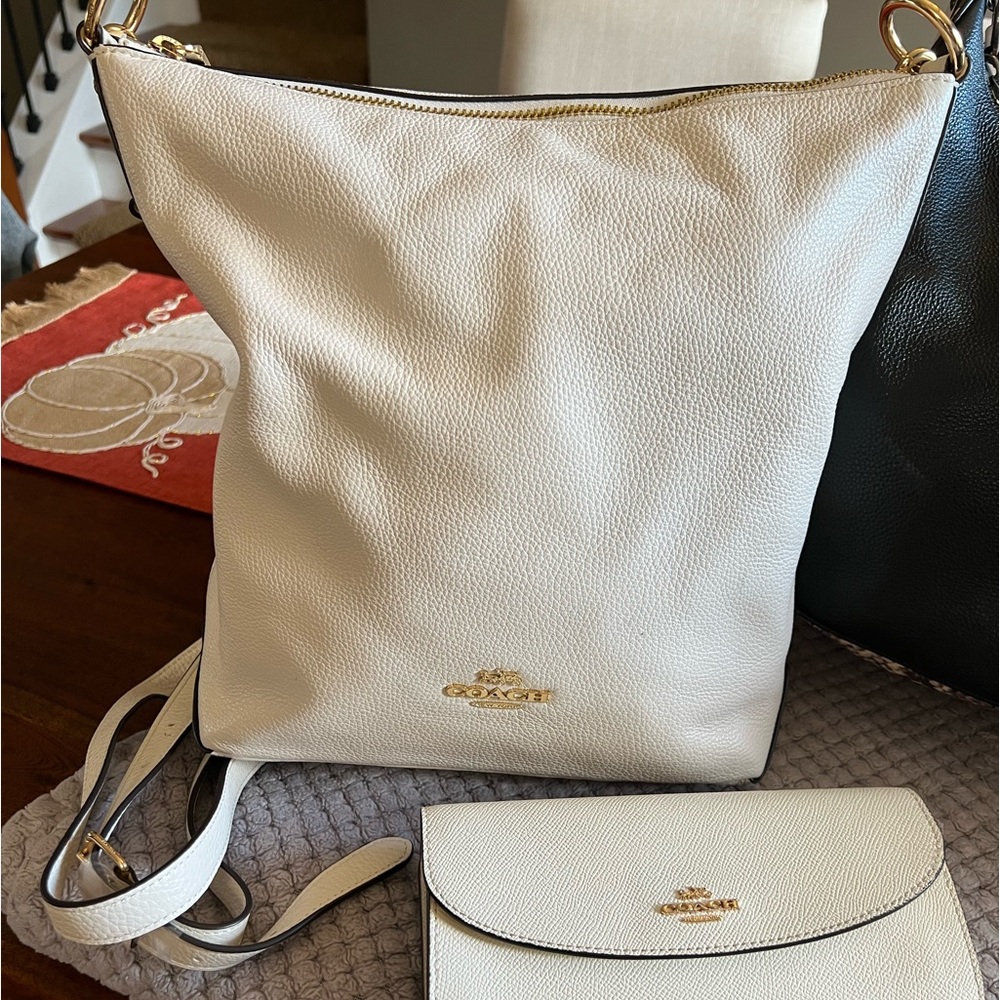 Coach bag with wallet and straps.